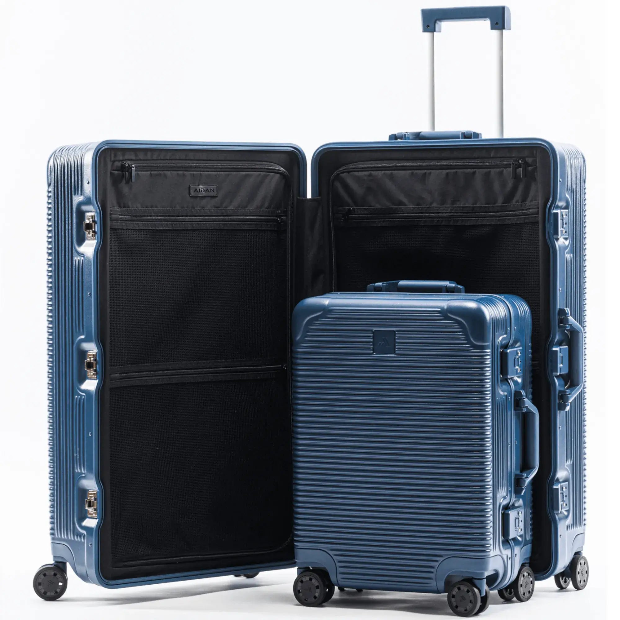 Two blue hardshell suitcases, one large and one small, with wheels and an extendable handle, packed for travel.